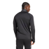 Rear view of a man with braided hair wearing a black athletic track jacket and matching pants against a white background.