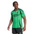 A man models a green Austin FC soccer jersey with a black YETI sponsor logo and black shorts against a white background.