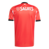 Back of a red SL Benfica soccer jersey with large white "SAGRES" text across the upper back and black and white trim on the collar and sleeves.