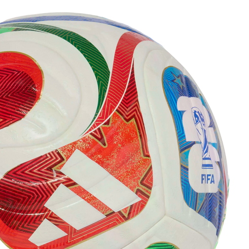 Close-up of a white soccer ball featuring red, green, and blue geometric patterns, a red maple leaf, the white Adidas logo, and a blue FIFA World Cup emblem.
