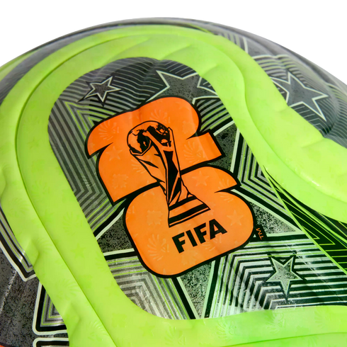 Close-up of a neon green and black soccer ball featuring an orange FIFA World Cup trophy logo and geometric star patterns.