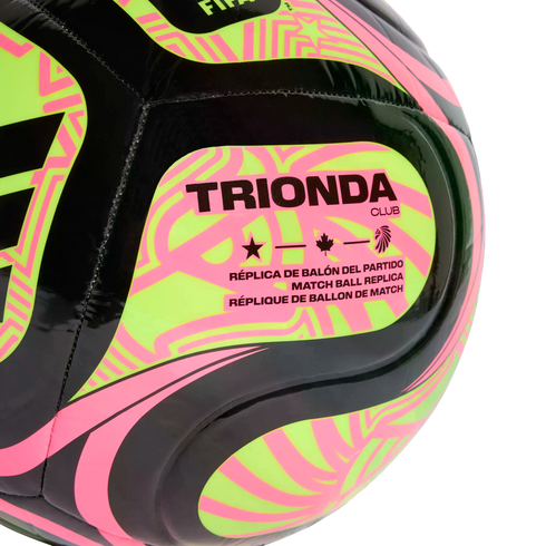 Close-up of a black, neon yellow, and pink TRIONDA CLUB soccer ball. The label "MATCH BALL REPLICA" is printed below star, maple leaf, and bird icons.