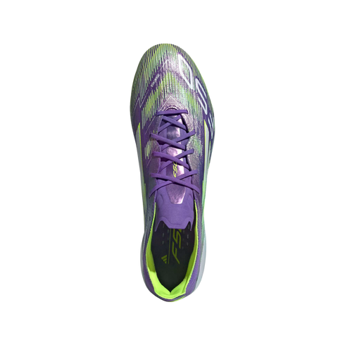 Top-down view of a purple Adidas soccer cleat with neon green accents and purple laces against a solid black background.