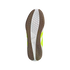 View of an Adidas sneaker's non-marking sole with white and brown gum rubber tread patterns and bright lime yellow side panels against a black background.