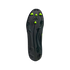 Bottom view of a black Adidas soccer cleat soleplate featuring neon green and black studs and an embossed logo.