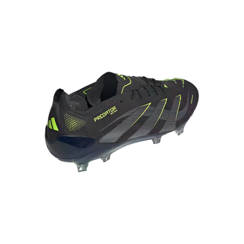 A black Adidas Predator soccer cleat with neon yellow accents, shown from a rear-side angle against a black background.