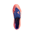 Top-down view of a coral and blue Adidas Predator soccer cleat against a black background, featuring a blue lace cover and white stripes on the side.