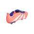 Salmon-colored Adidas Predator soccer cleat with white stripes and a blue fold-over tongue, shown from the side against a black background.