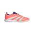 Profile view of a bright coral Adidas Predator soccer shoe with white stripes and purple details, featuring a turf-cleat sole, set against a black background.