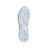 Light blue and orange rubber outsole of an Adidas Predator turf soccer shoe with traction studs on a black background.