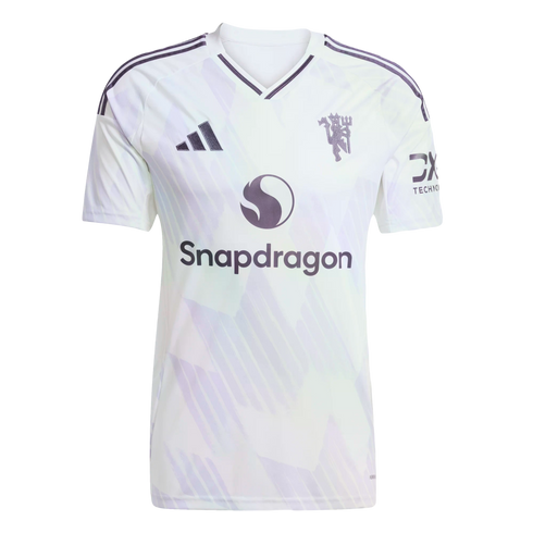 White Manchester United jersey with a subtle light purple geometric pattern, featuring the Adidas logo, club crest, and Snapdragon sponsor.