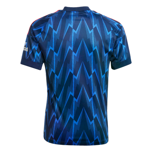 Back view of a navy and bright blue football jersey featuring a jagged lightning bolt pattern and red stripes on the shoulders.