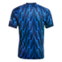 Back view of a navy and bright blue football jersey featuring a jagged lightning bolt pattern and red stripes on the shoulders.
