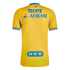 The back view of a yellow Tigres UANL soccer jersey featuring blue trim and sponsor logos for Tecate, Afirme, and H-E-B.