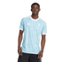 A young Black man models a light blue patterned Juventus soccer jersey with white trim against a plain white background.
