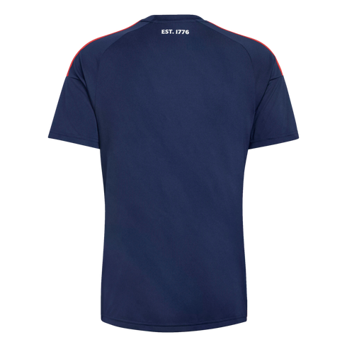 The back of a navy blue t-shirt featuring red shoulder stripes and "EST. 1776" printed in white near the neckline, shown against a black background.
