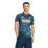 A male model wears a navy Philadelphia Union soccer jersey featuring gold logos and historical graphics, paired with navy shorts against a black backdrop.
