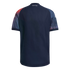 Back view of a navy blue soccer jersey with red and teal patterned sleeves and the word "HOUSTON" printed on the back neck.