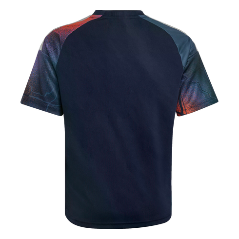 Back view of a navy blue t-shirt with graphic-patterned raglan sleeves in red, orange, and blue against a black background.