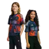 Two smiling children posing in vibrant Houston Dynamo FC soccer jerseys against a black background.