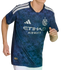 A person wearing a blue NYCFC soccer jersey with a geometric pattern, white shoulder stripes, and the Etihad Airways sponsor logo.