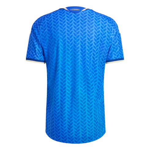 Back view of a blue soccer jersey with a dark blue leaf pattern, white and gold trim, and the word "AZZURRA" printed in gold on the back collar.
