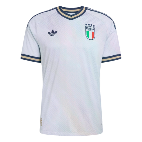 White Adidas Italy national football team jersey featuring a subtle pattern, trefoil logo, team crest, and navy and gold trim on the collar and sleeves.
