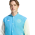 A man with light brown hair wearing a light blue and white Adidas varsity jacket featuring the Inter Miami CF crest.