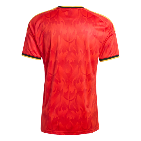 Back view of a red soccer jersey with a subtle tonal trident pattern, yellow shoulder stripes, and black and yellow trim on the collar and sleeve cuffs.