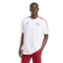 A man models a white Adidas Arsenal T-shirt with red accents and matching red track pants against a plain black background.