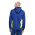 Rear view of a man with blond hair wearing a blue hoodie and matching pants with yellow side panels and white piping, set against a black background.