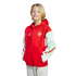 A young blonde boy smiles, wearing a red and white Arsenal zip-up hoodie against a black background.
