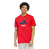 A man wears a red Adidas Arsenal t-shirt with a navy logo and white "ARSENAL" lettering. He is paired with light grey shorts against a solid black background.