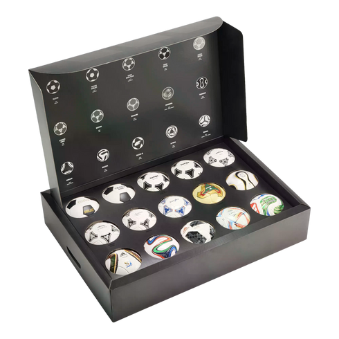 A black box collection featuring fourteen mini replicas of historic FIFA World Cup match balls, with their names and designs illustrated on the open lid.