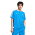 A young man wearing a bright blue pinstriped Real Madrid Adidas jersey and matching pants against a solid black background.