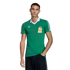A man models a green Mexico national team soccer jersey with white trim and an Adidas logo against a solid black background.