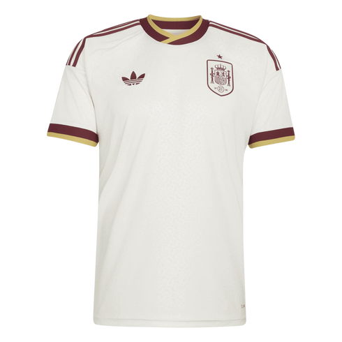 White Spain national team soccer jersey with maroon and gold accents. Features Adidas trefoil and team crest on the chest, and three stripes on the shoulders.