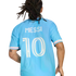 Back view of a person with dreadlocks wearing a light blue soccer jersey with the name 'MESSI' and number '10' printed on the back.