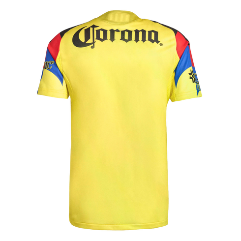 The back of a yellow soccer jersey featuring the black "Corona" logo across the upper back. The short sleeves have red, blue, and black geometric patterns and additional branding.