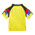Back view of a bright yellow short-sleeved jersey with black shoulders and vibrant red, blue, and yellow geometric patterns on the sleeves.