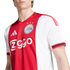 Close-up of a person wearing an official red and white Ajax Amsterdam home jersey with the club crest and Ziggo sponsor logo.