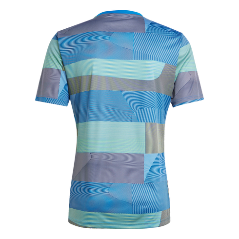The back of a short-sleeved athletic jersey with a complex geometric pattern of blue, teal, lime green, and grey stripes arranged in horizontal and curved blocks.