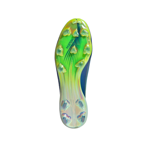 Underside of an iridescent lime green and blue Adidas soccer cleat with triangular studs and "MESSI" branding, centered on a black background.