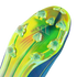 Vibrant lime green and blue iridescent soleplate of a Messi soccer boot with transparent studs and "MESSI" branding.