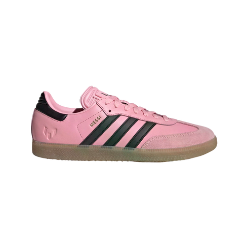Side profile of a pink Adidas Samba sneaker with black stripes, a gum sole, and "MESSI" in gold lettering on the side.