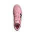 Top-down view of a pink Adidas sneaker with black stripes and pink laces, featuring the Messi "M" logo on the tongue, isolated on a white background.