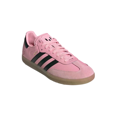 Pink Adidas Messi Samba sneaker with black stripes and a gum sole.