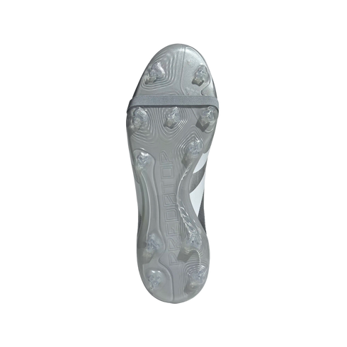 Soleplate view of a silver Adidas Predator soccer cleat showing clear molded studs and a grey elastic strap across the forefoot.