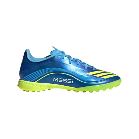 Side profile of a blue Adidas Messi soccer turf shoe with yellow accents, yellow studded sole, and "MESSI" branding on the side, against a black background.