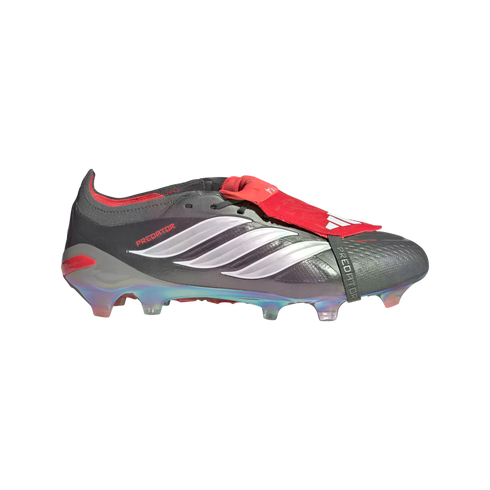 Adidas Predator soccer cleat in metallic grey with silver stripes, a red fold-over tongue secured by a black strap, and an iridescent soleplate.